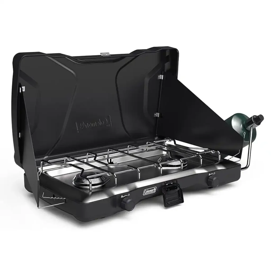 Coleman Triton propane camping stove on a picnic table