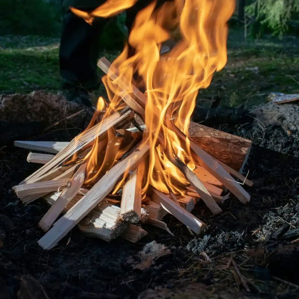 Tipi style campfire wood structure setup