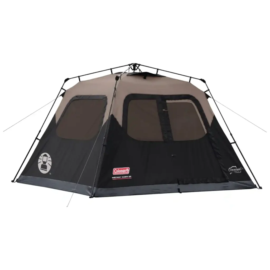 Coleman Instant Cabin tent with rigid frame staked down in wind