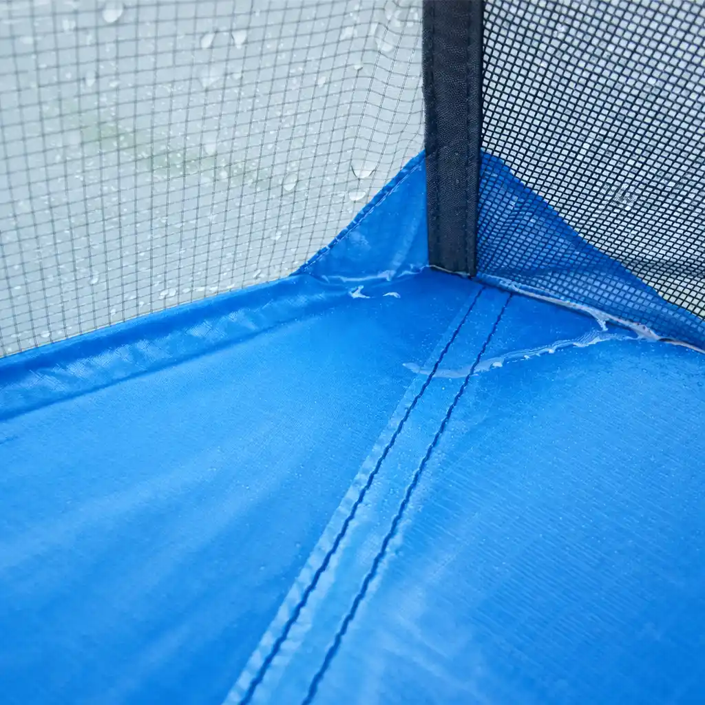 blue camping tent floor with condensation and water droplets on mesh interior