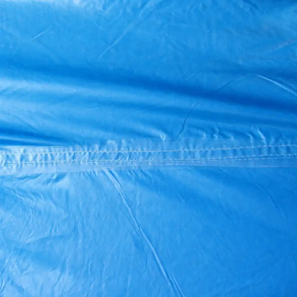 close up of tent fabric flapping in wind showing loose panel