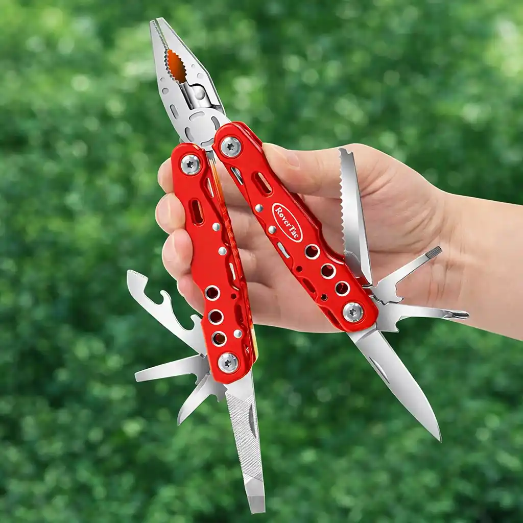 A bright red multi-tool with unfolded tools lying on a wooden log outdoors, with a red camping bag and a water bottle in the background