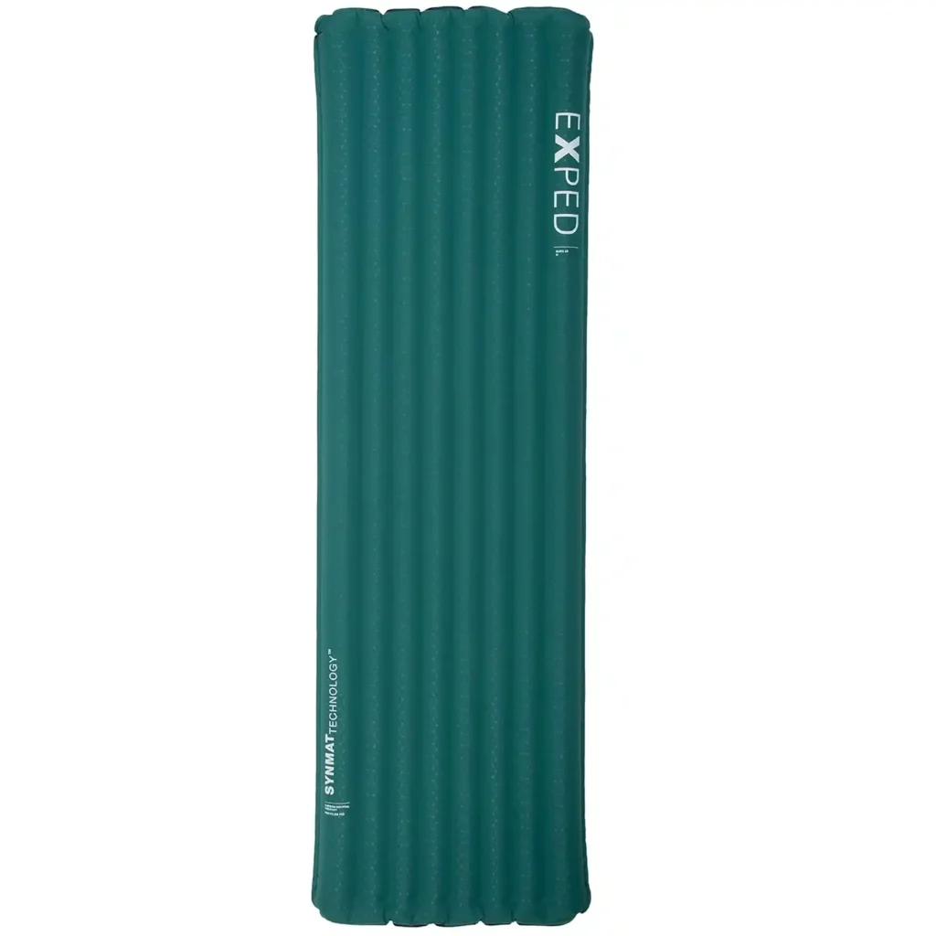 Exped Dura 5R sleeping pad laid out on a tent floor, highlighting durable fabric and anti-slip surface for stable overnight sleep