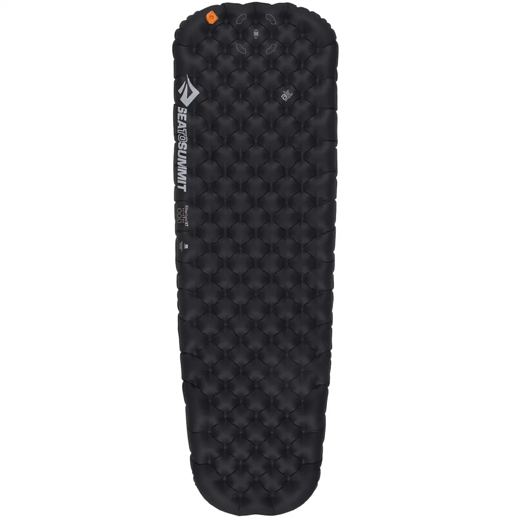 Sea to Summit Ether Light XT Extreme sleeping pad set up in a tent, showing wide air cell construction that helps prevent sliding on uneven ground