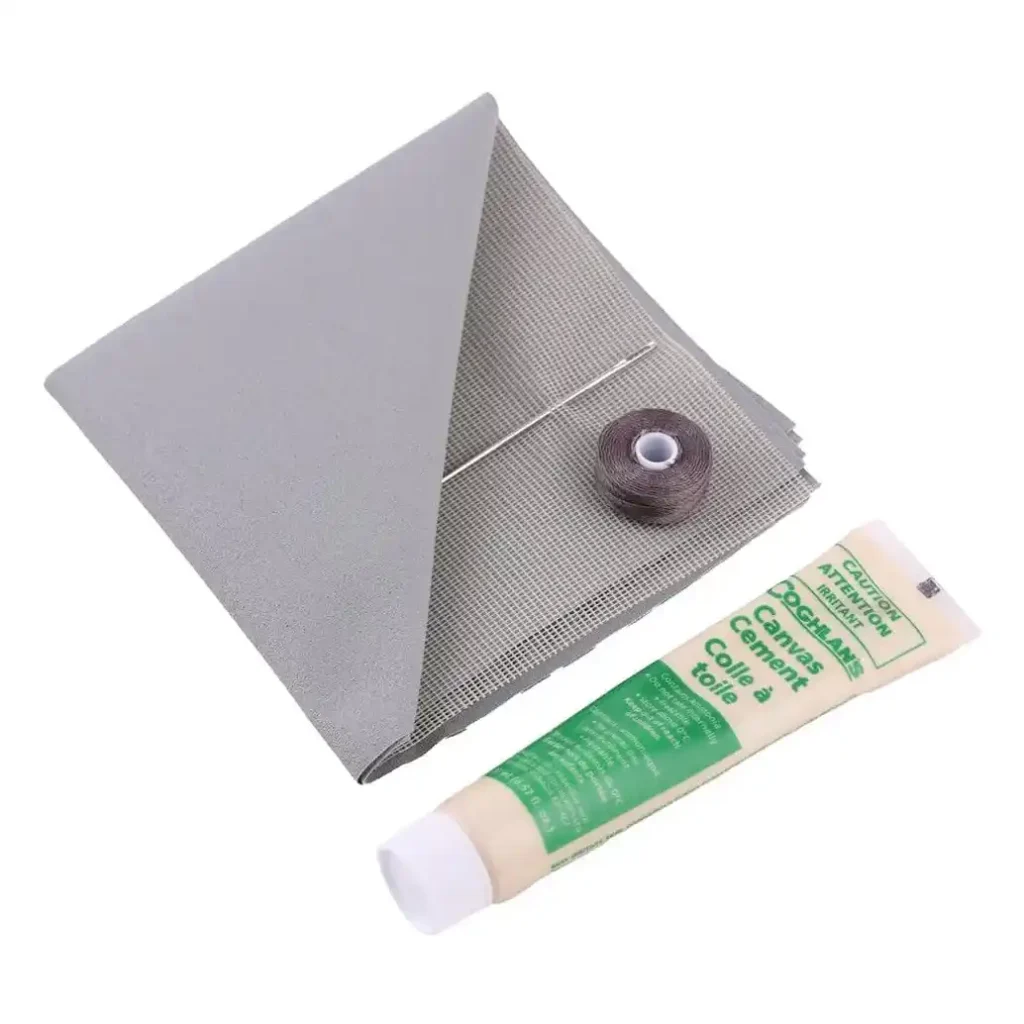 Coghlans tent repair kit with nylon mesh and canvas patches for camping gear