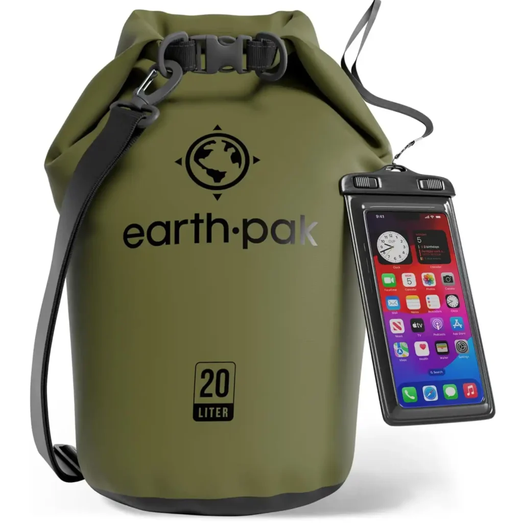 Earth Pak waterproof dry bag beside camping gear during a rainy campground trip