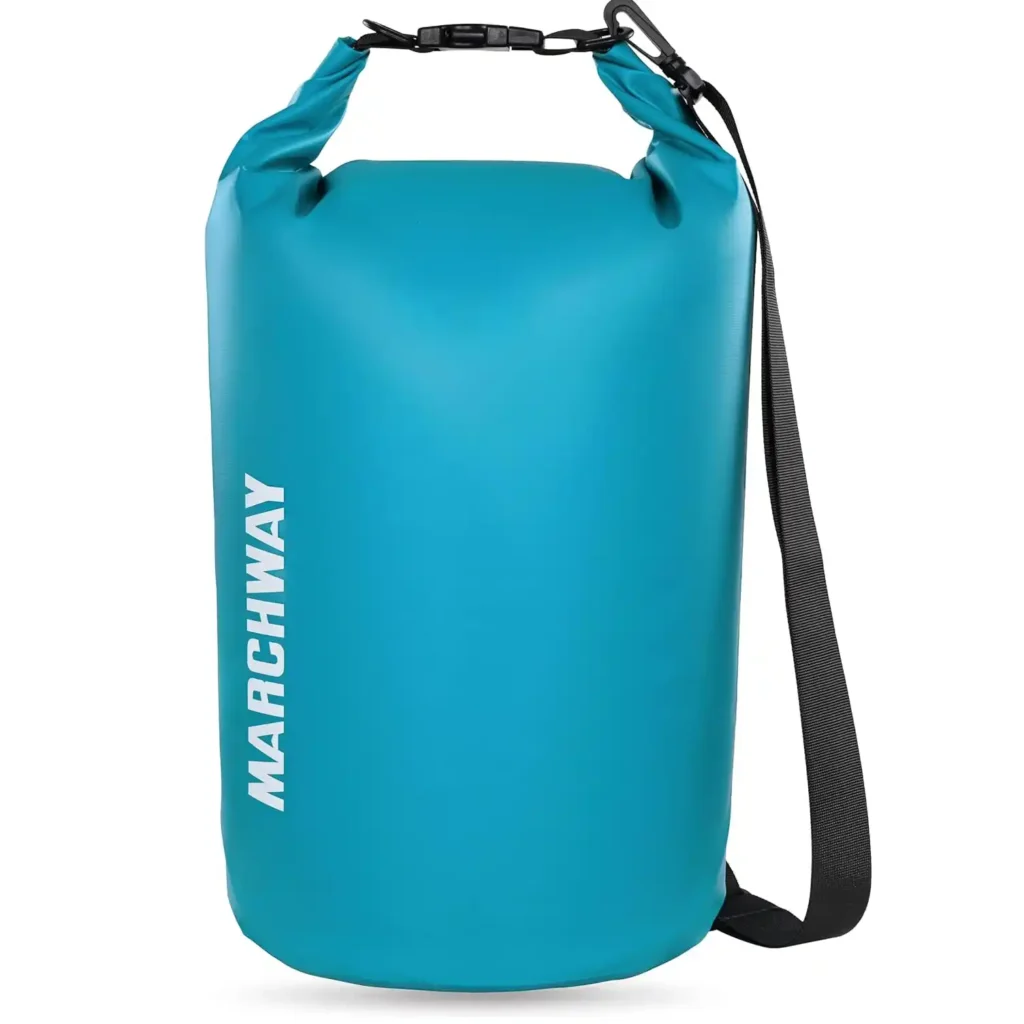 MARCHWAY floating waterproof dry bag beside camping gear at a rainy family campsite
