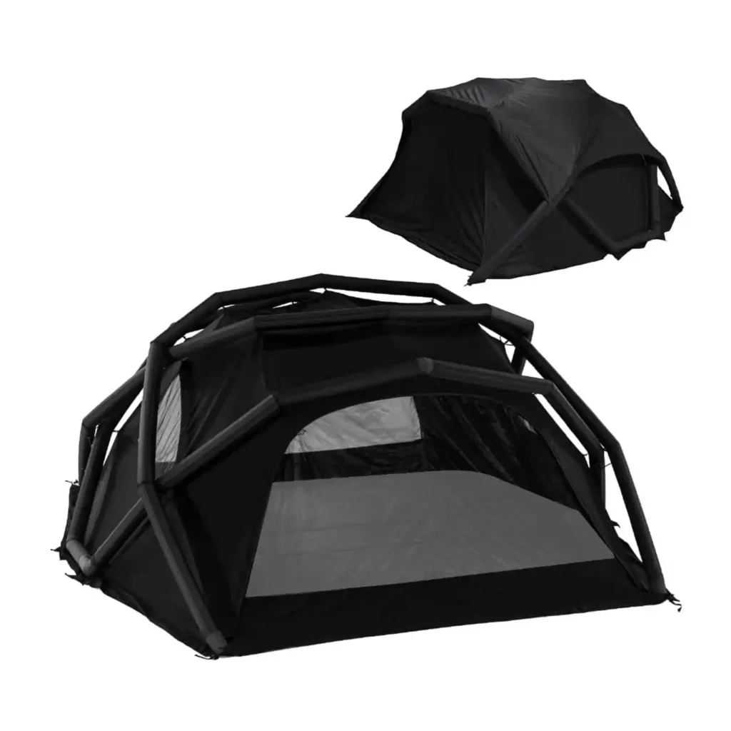 CAMVIL inflatable camping tent at a sunny mountain campsite with camping chairs and outdoor dining area