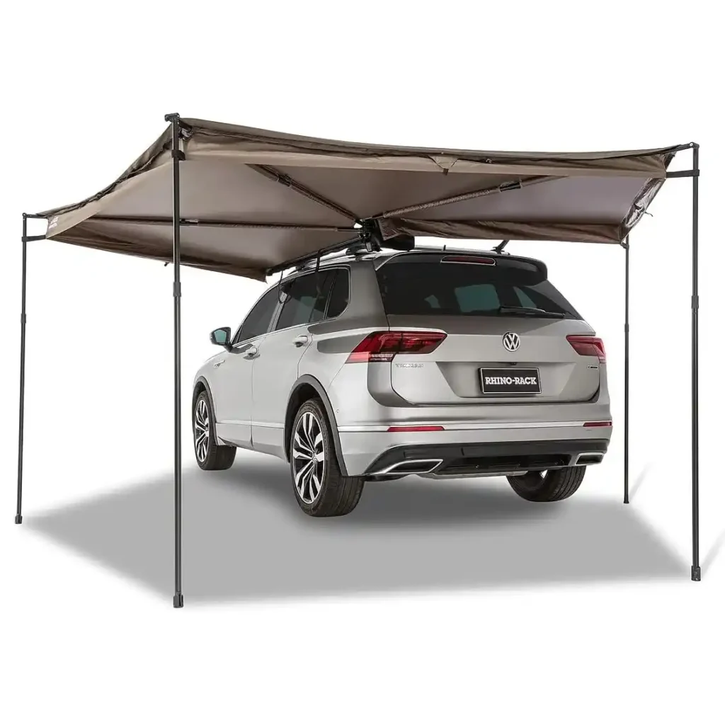 Rhino-Rack Batwing 270 Compact Awning mounted on an SUV roof rack for overlanding and vehicle camping.